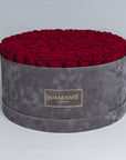 85-100 Roses in Super Deluxe Round Grey Suede Rose Box