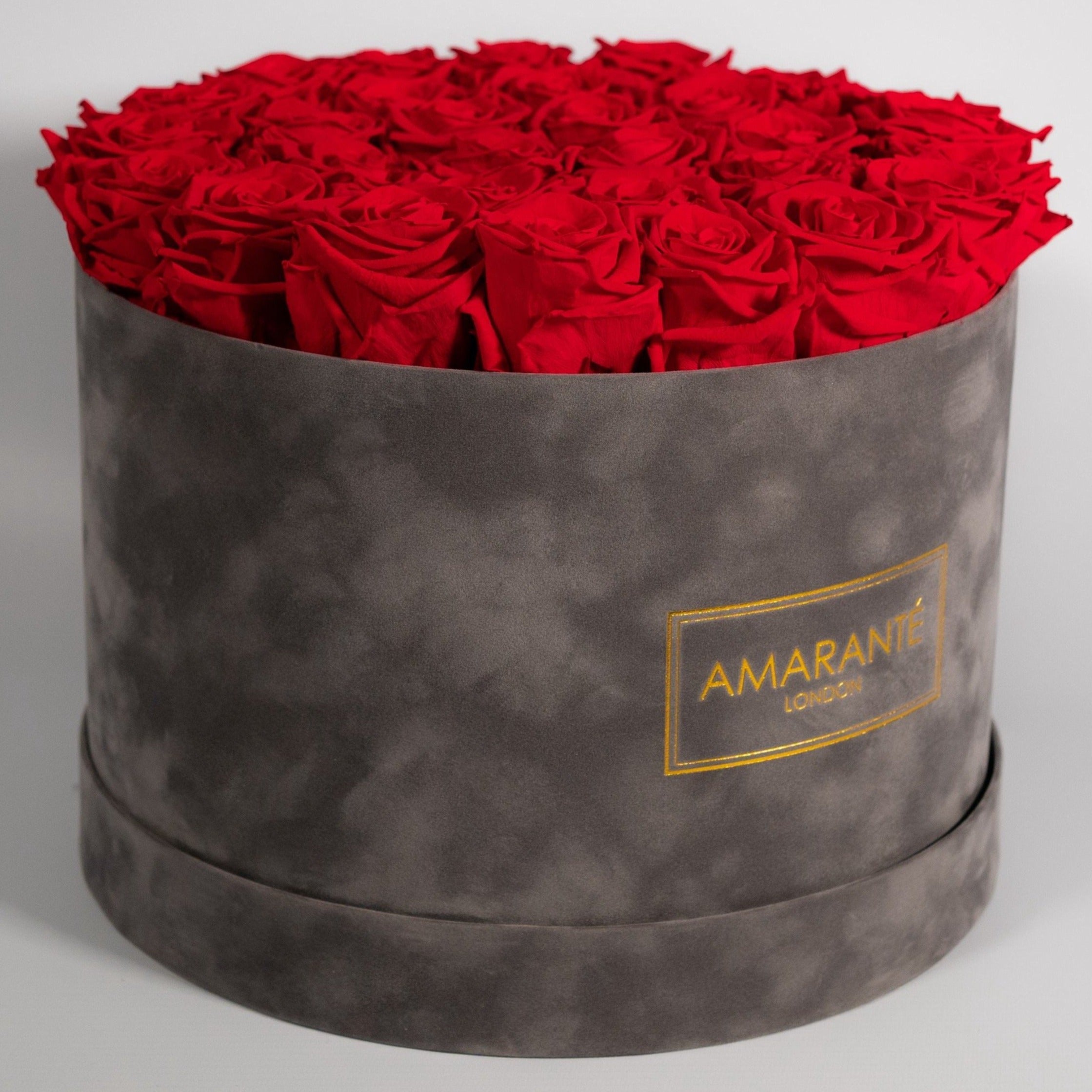 Divine Red Roses displayed in a dapper grey box 