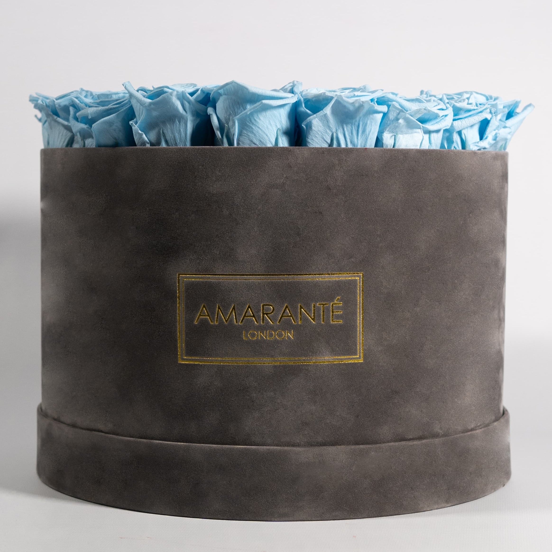 Aromatic light blue Roses in a trendy grey package 