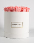 Delicate light pink Roses encompassed in a beautiful white box 