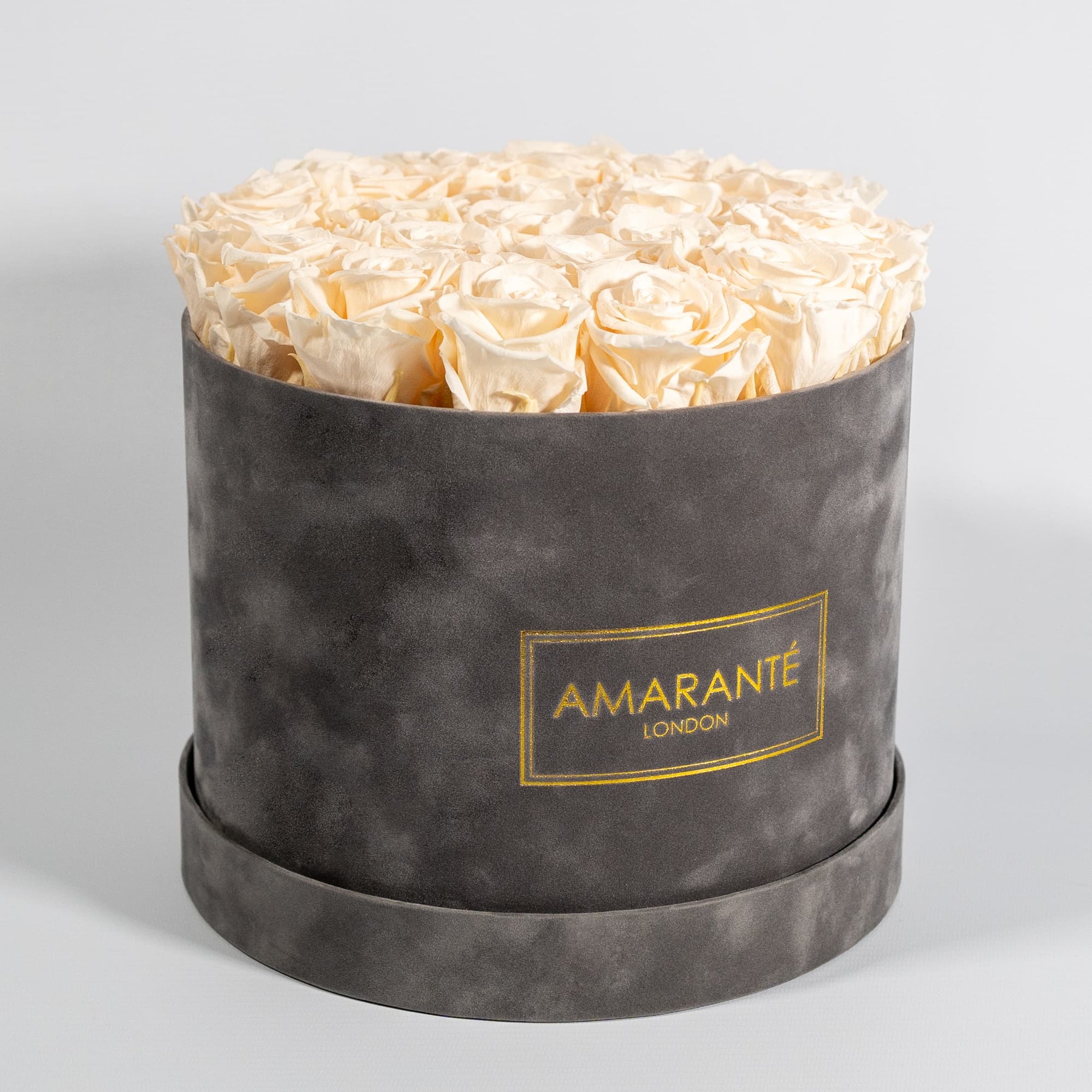 Delicate champagne Roses available in a sleek grey box 