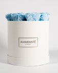 Elegant light blue Roses in a vogueish white round box 