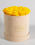 Abloom yellow roses presented in a chic beige medium box. 