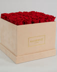Magical red Roses in an elegant beige box in large size. 