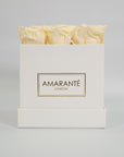Chic champagne roses in a charming white box 