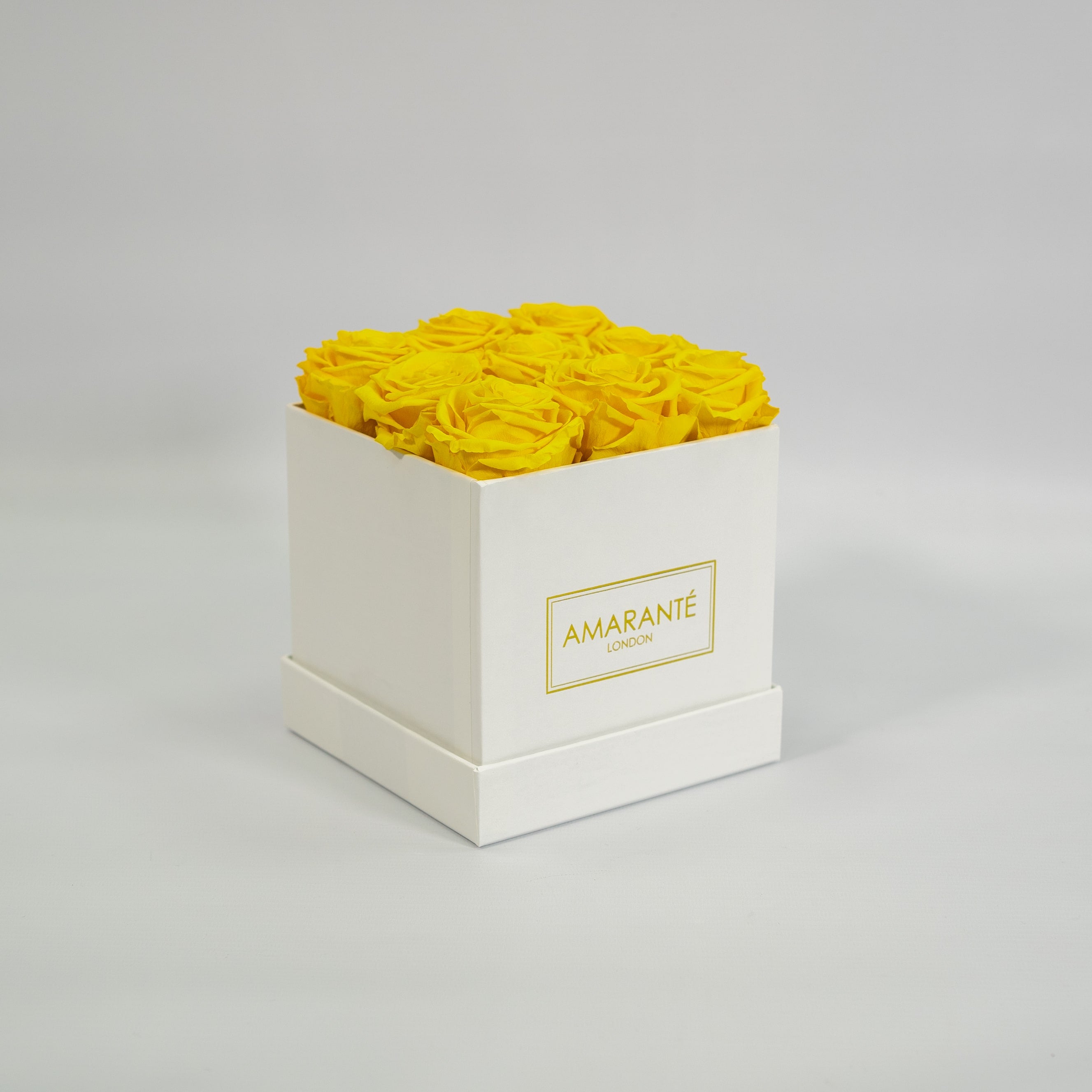 Delightful yellow roses imbedded in a magical white box