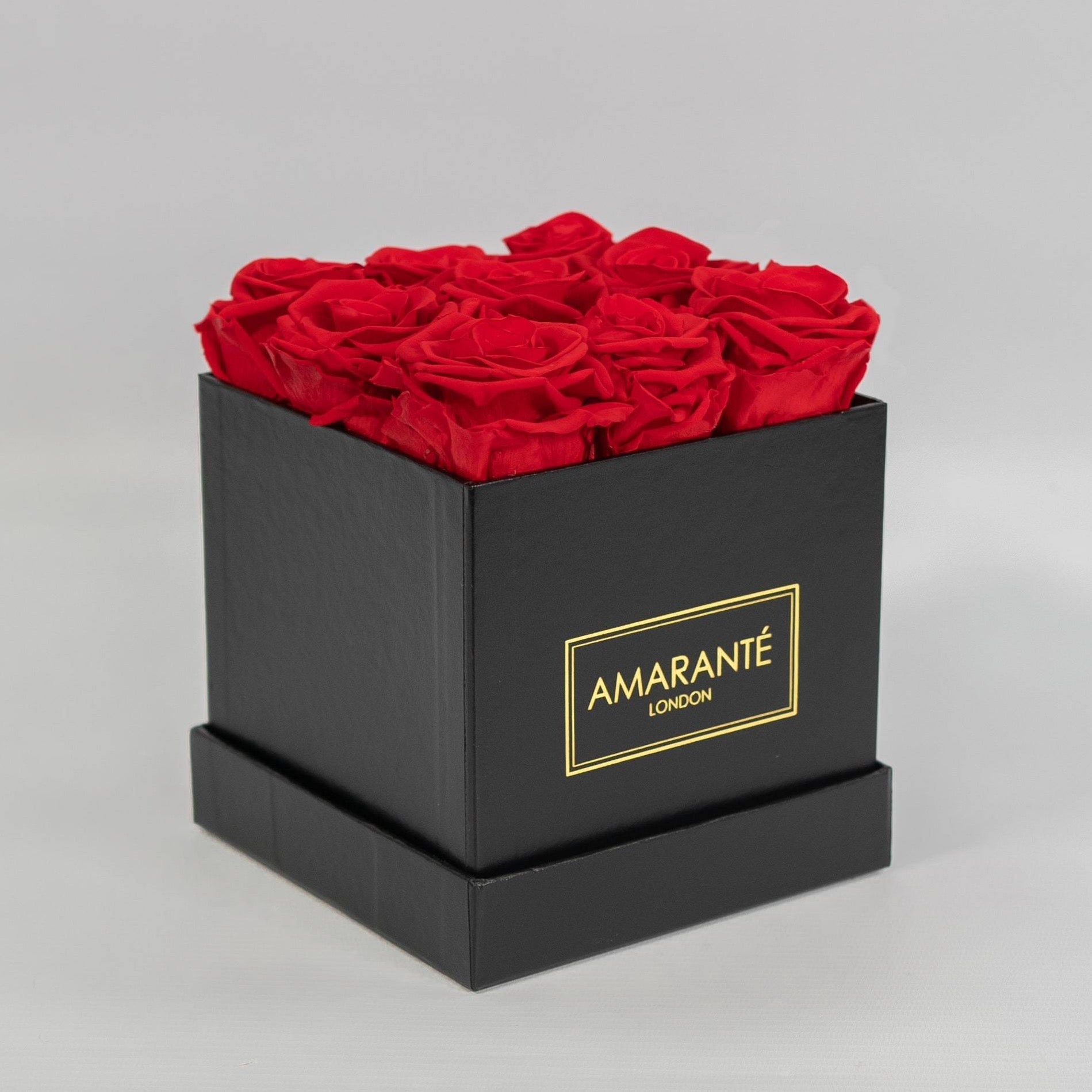 Stunning red Roses featured in a dapper black medium box