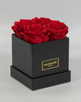 Aromatic red roses in a dapper black small square box 