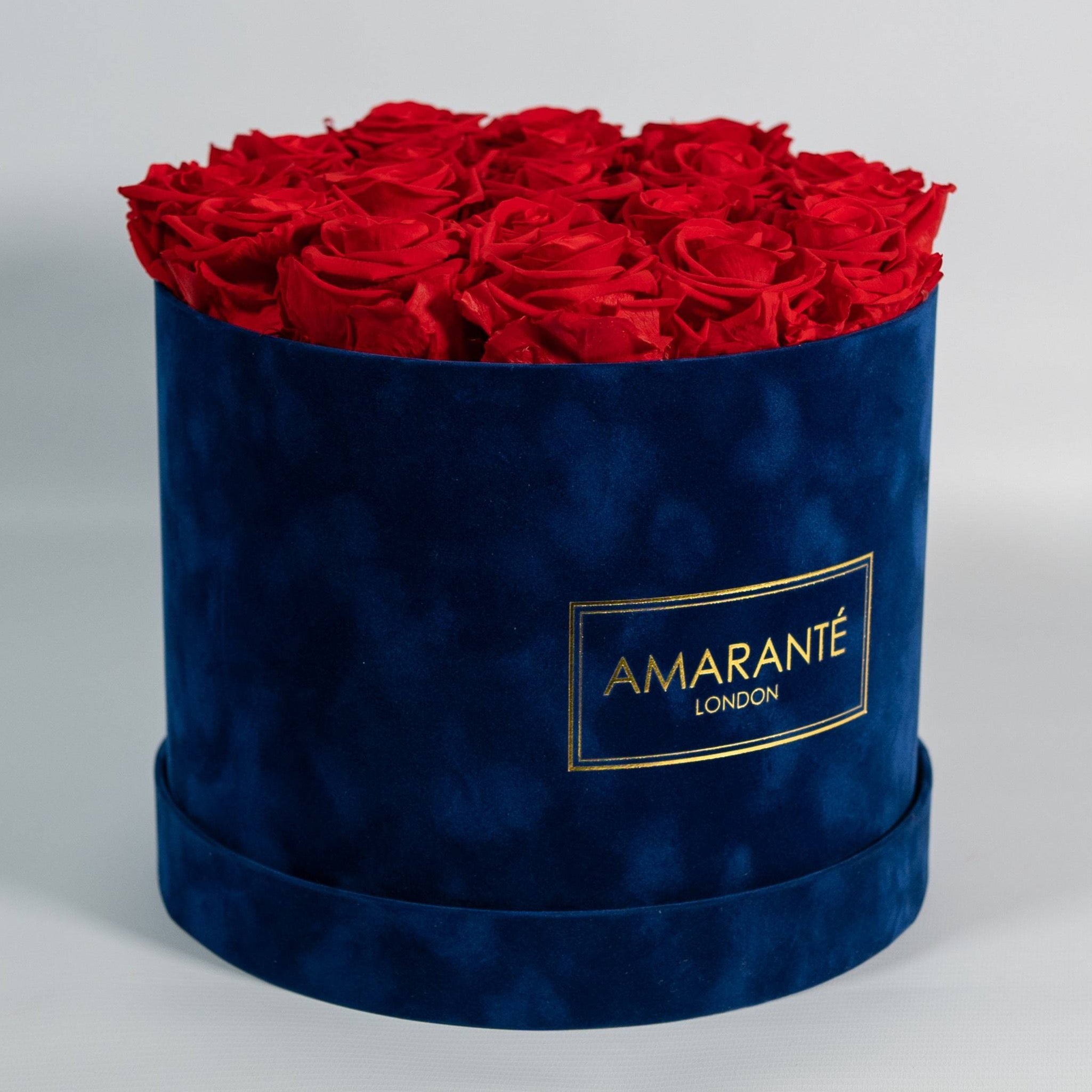 Enchanting red Roses in an elegant dark blue box 