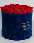 Enchanting red Roses in an elegant dark blue box 
