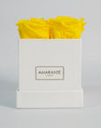 Delightful yellow roses shown in a magical white box