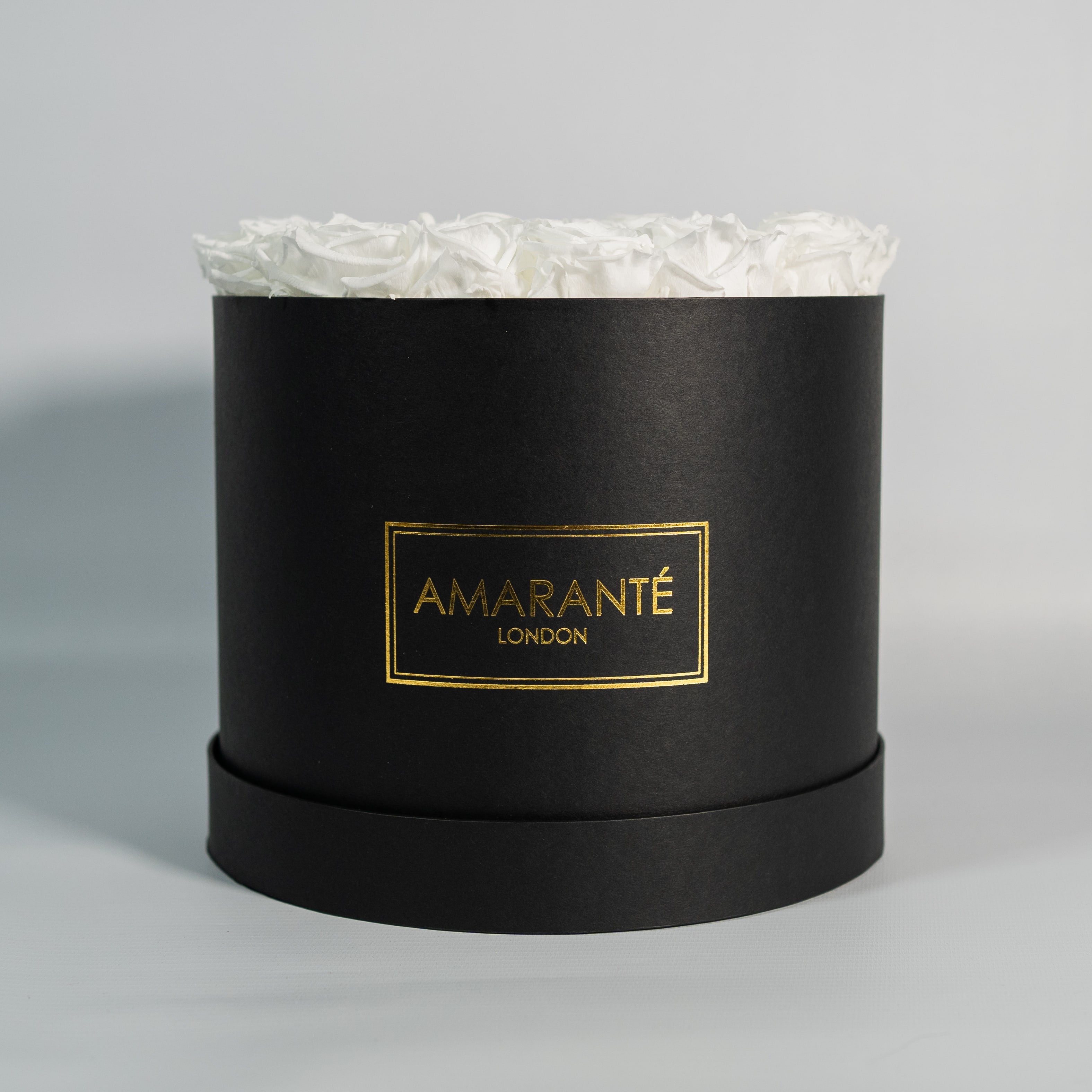 Elegant white Roses in a stylish black box 