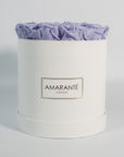 Majestic lavender roses imbedded in a majestic white box 