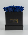 Luxurious royal blue roses featured in a stunning black box 