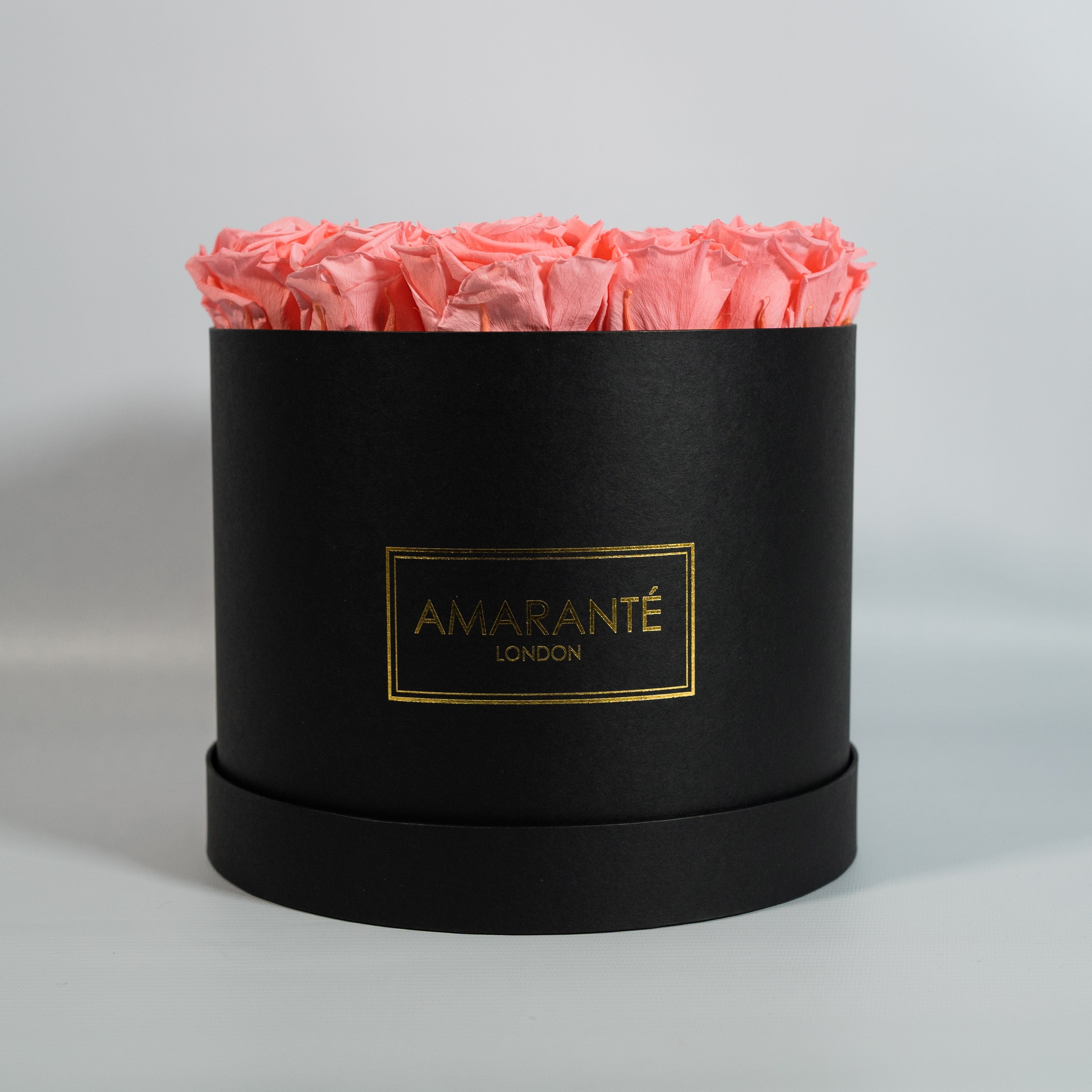 Tender light pink Roses available in a large round hatbox 