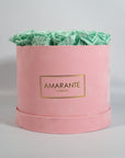 Revitalising mint green Roses featured in a delicate pink box 