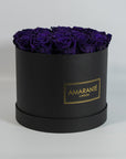 Luxurious dark purple Roses featured in a modish black box