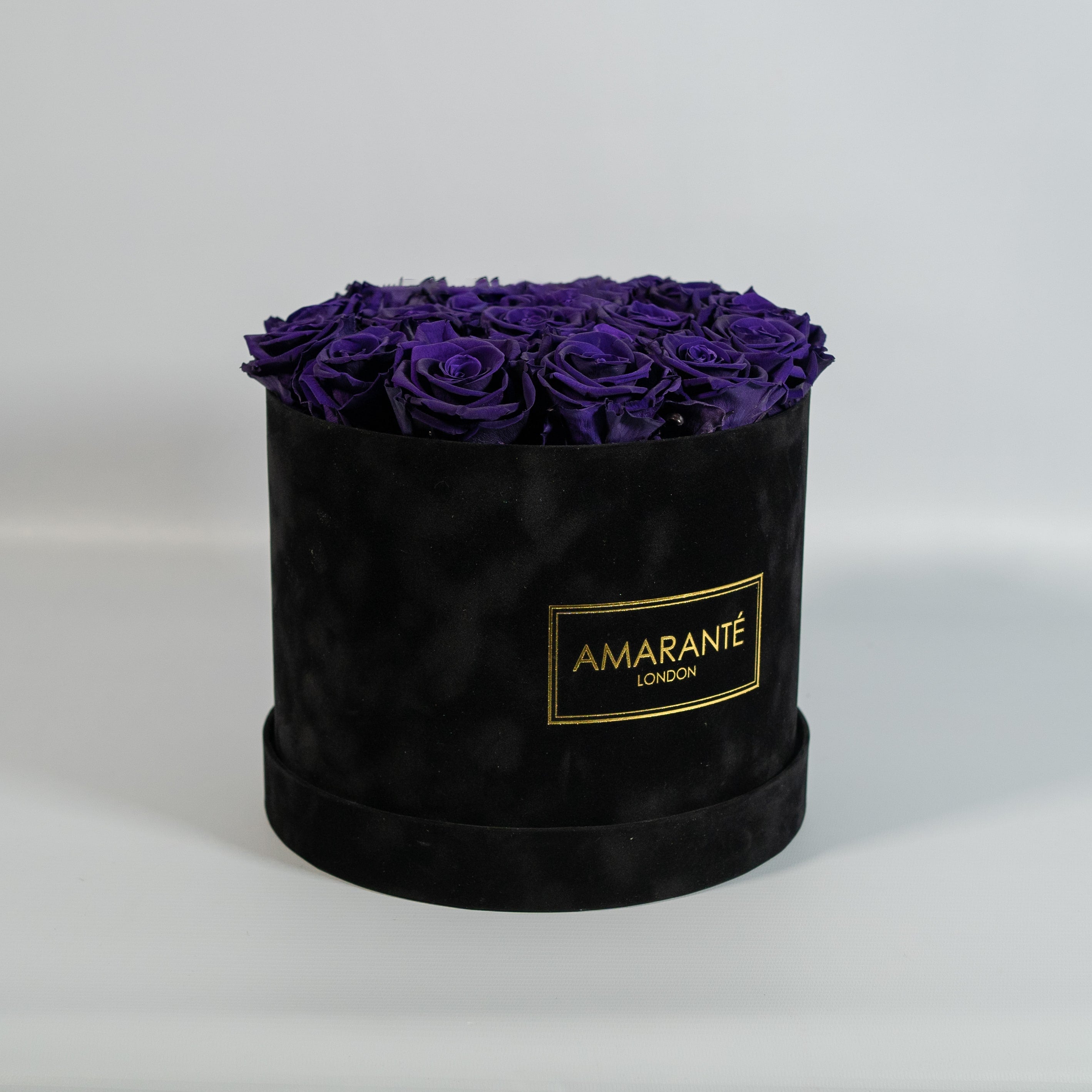 Luxurious dark purple Roses in a modish black box 