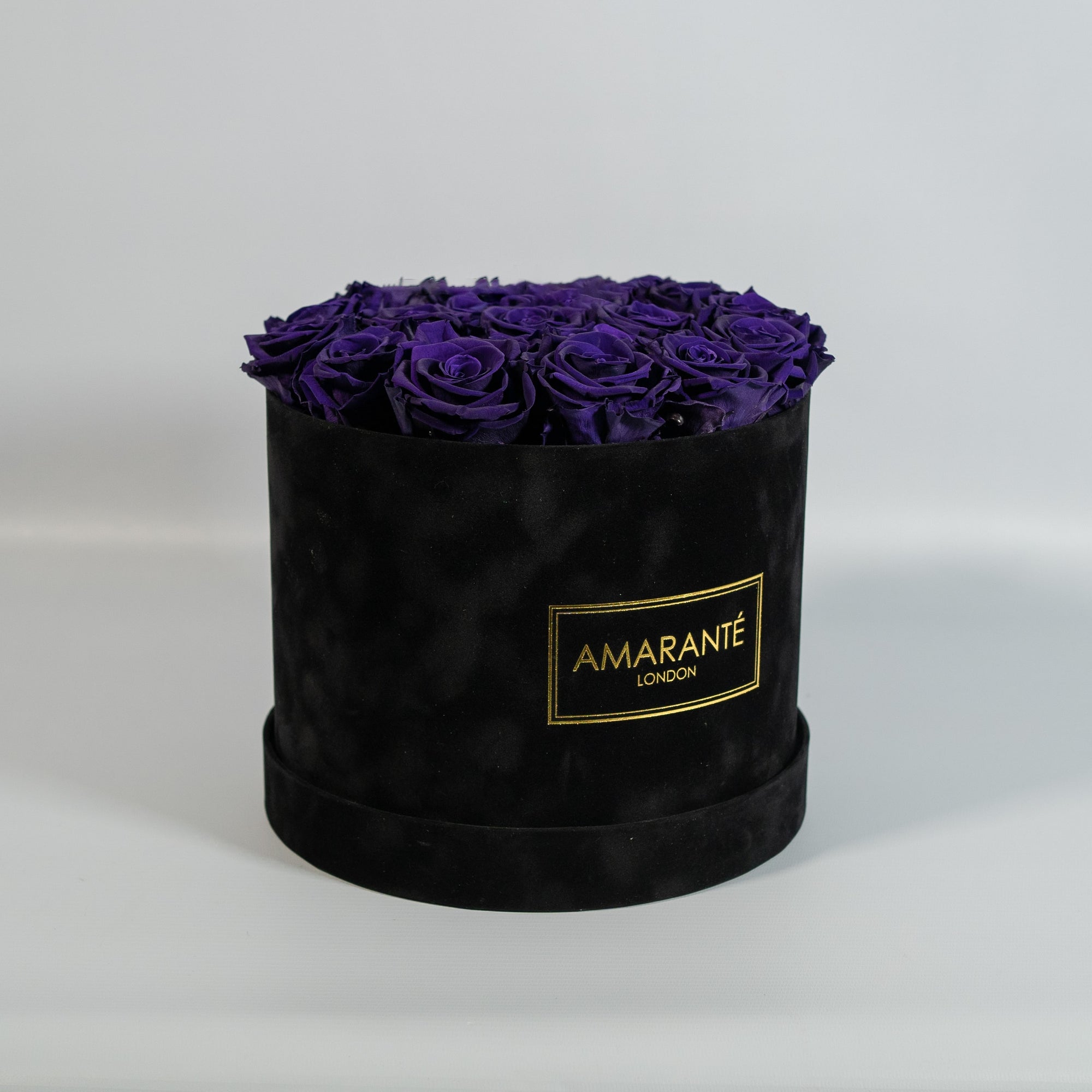 Luxurious dark purple Roses in a modish black box 