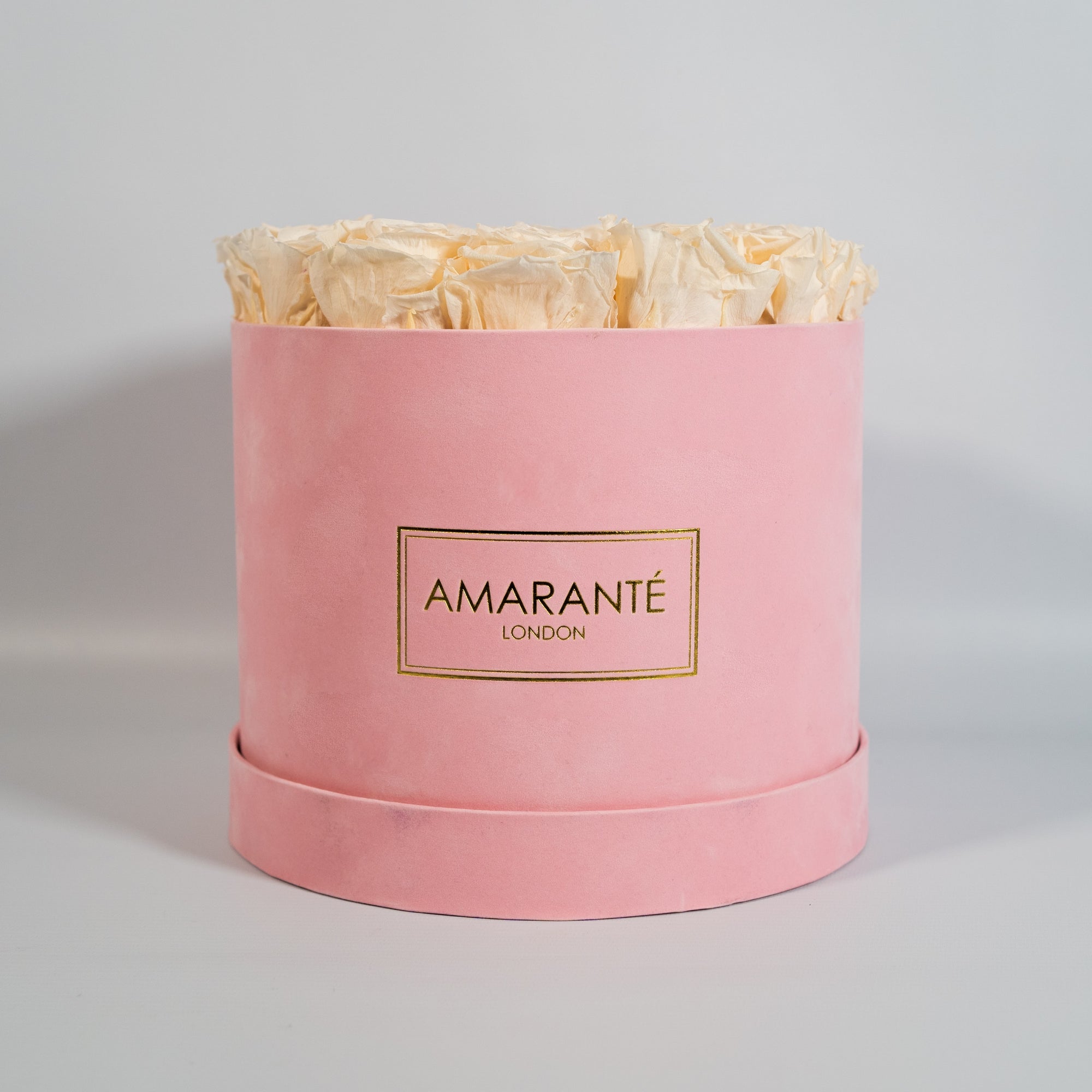 Tranquilising champagne Roses in a dapper pink box 