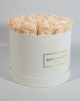 Exciting champagne Roses displayed in a modish white large box 