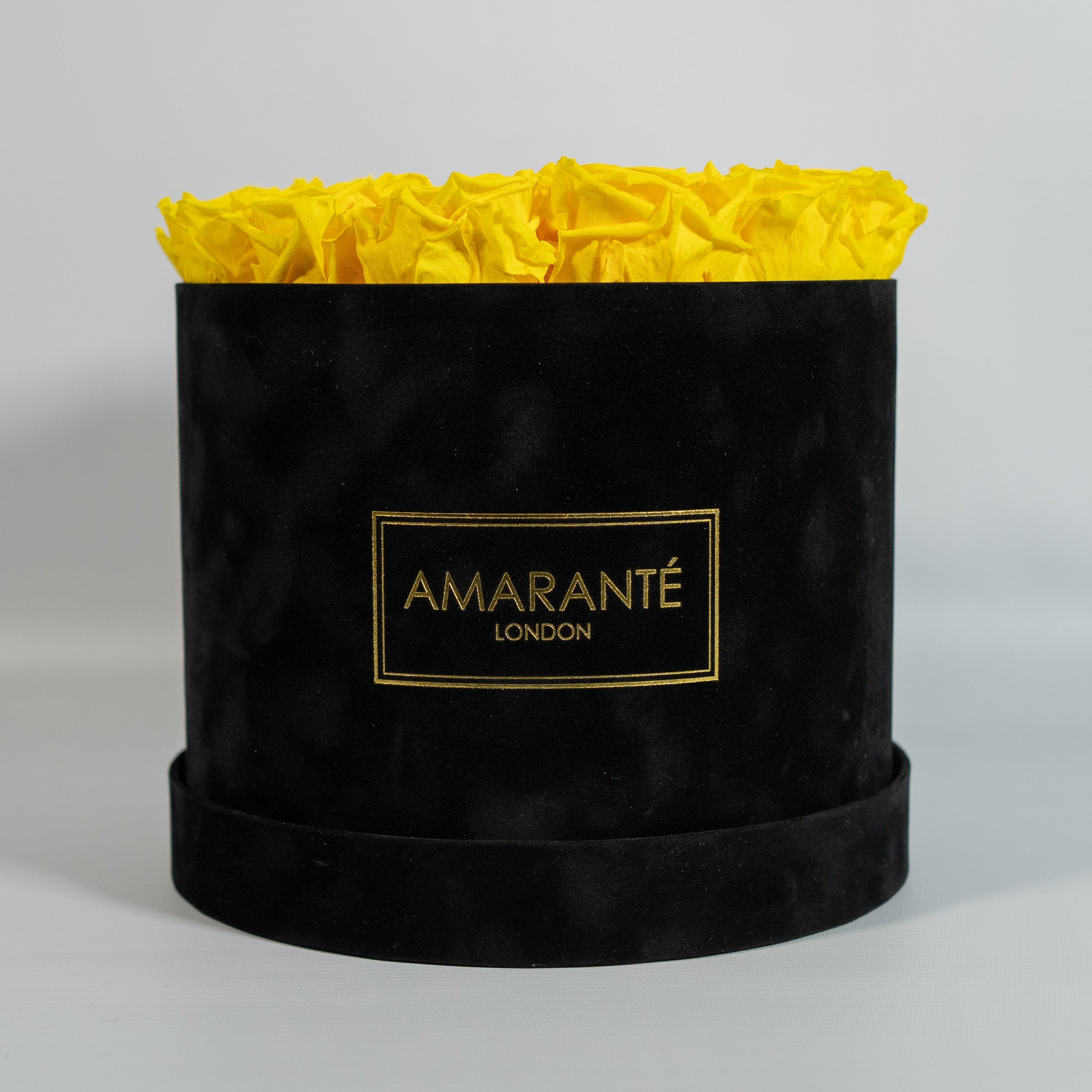 Delightful yellow Roses delicately imbedded in an idyllic black box 