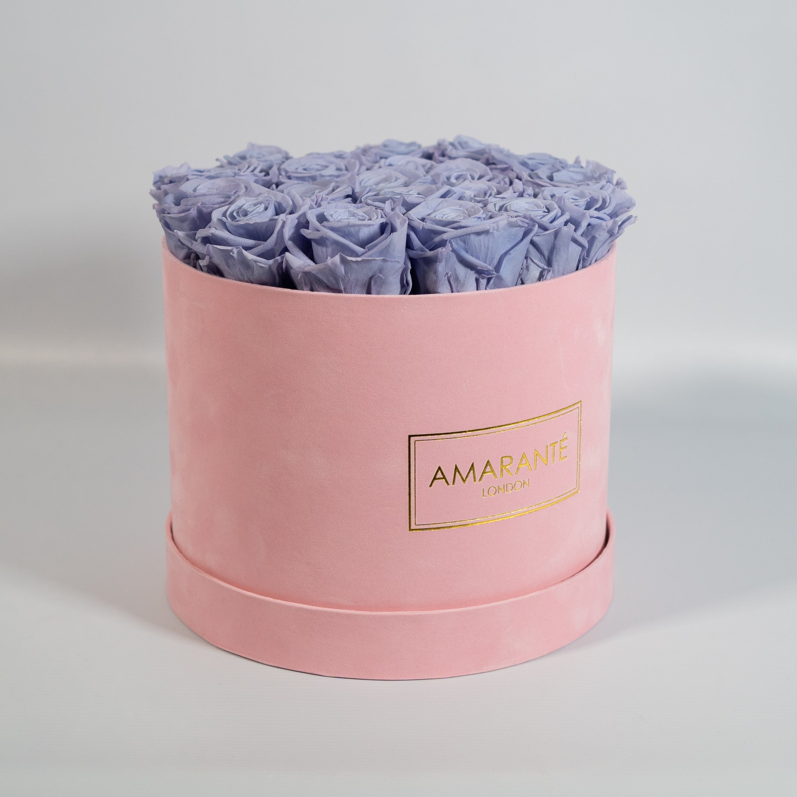 Spring time inspired lavender  Roses shown in a stylish pink box 