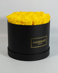 Delightful yellow Roses in an idyllic black box 