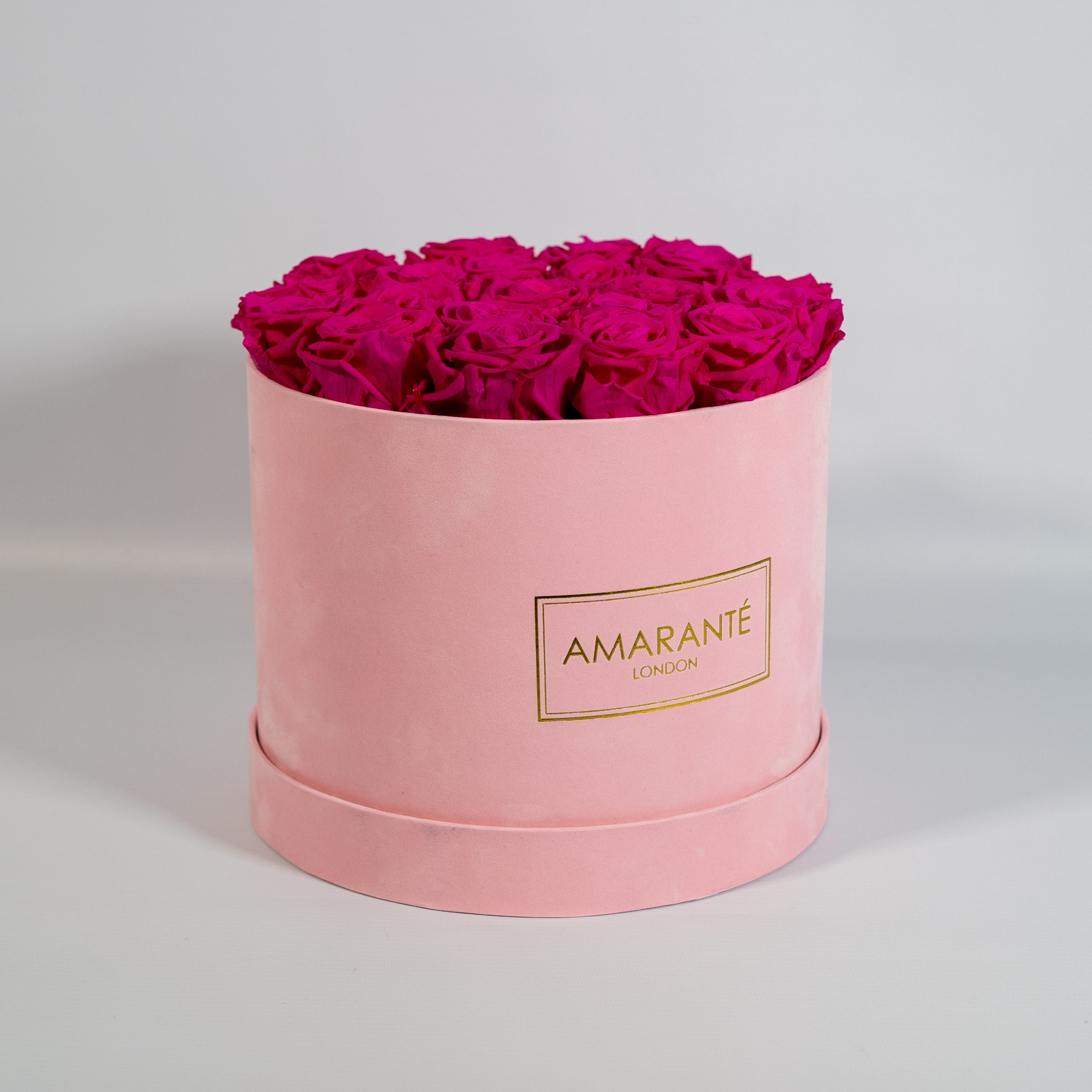 Expressive hot pink Roses in a magical pink box 