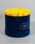 Delightful yellow roses encompassed in a sophisticated blue box 