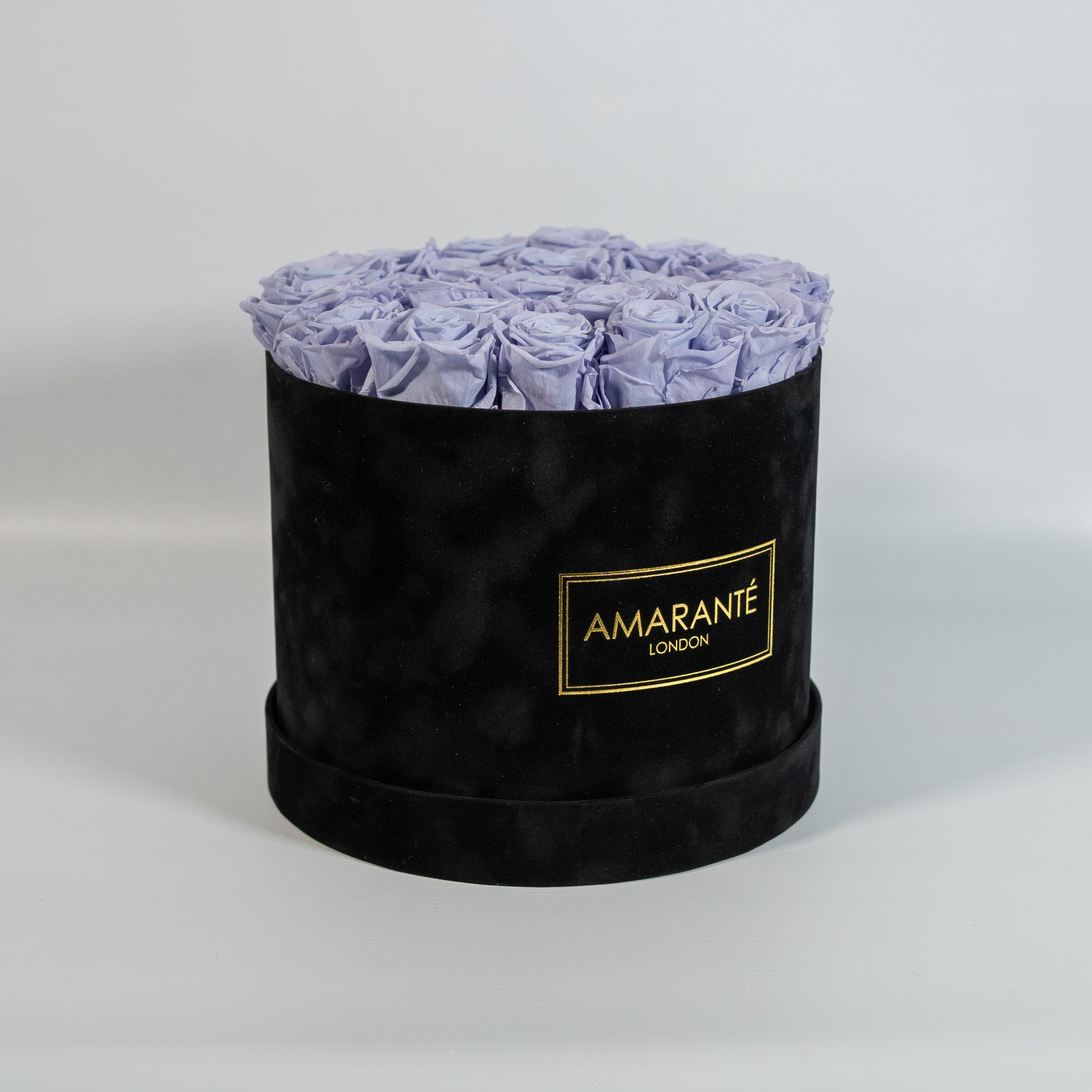 Spring-time inspired lavender Roses in a sophisticated black box 