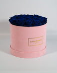 Dapper royal blue Roses in a chic pink box 