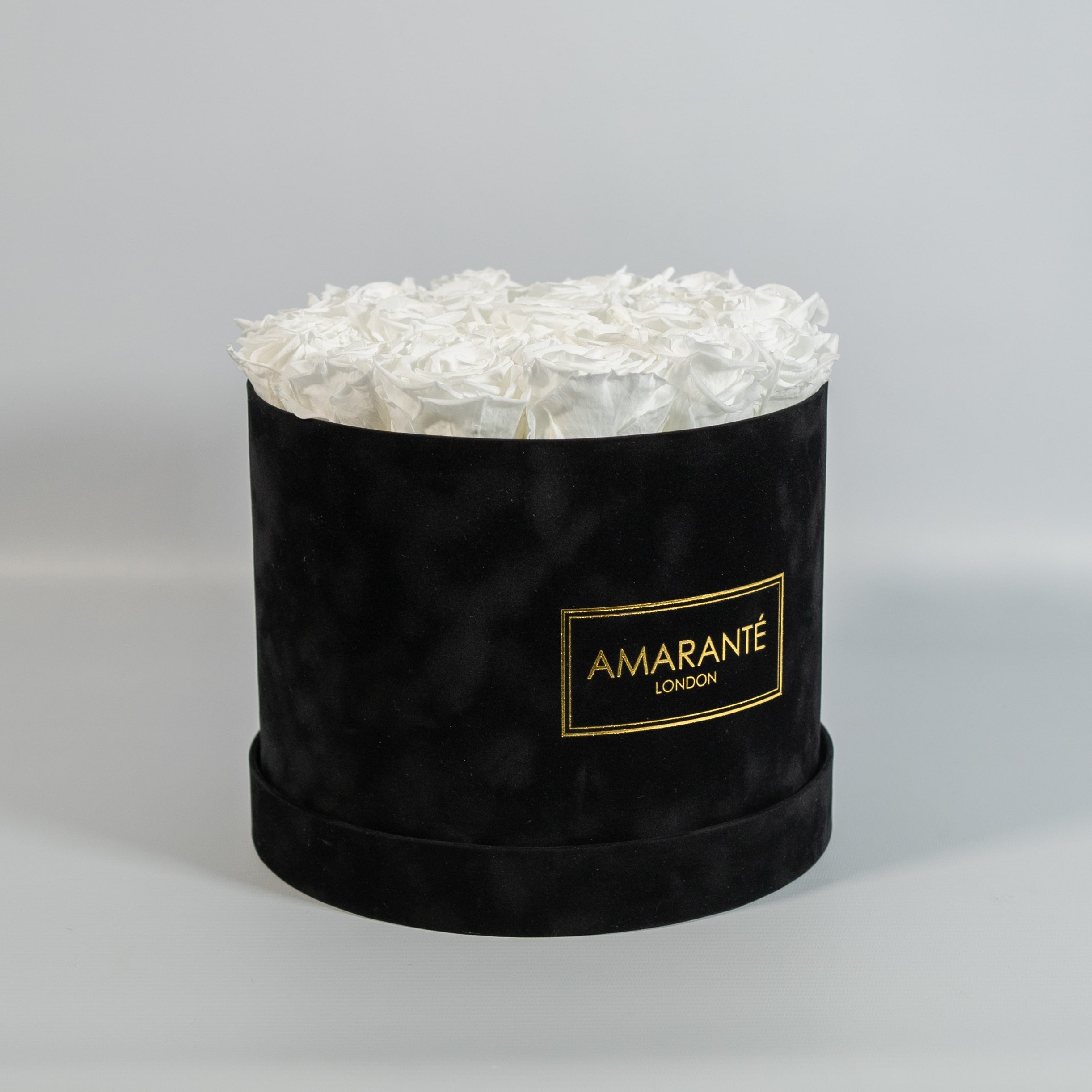 Charming white Roses in a dapper black large box 