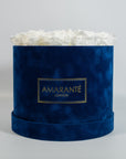 Magical white Roses encompassed in a stylish blue box 