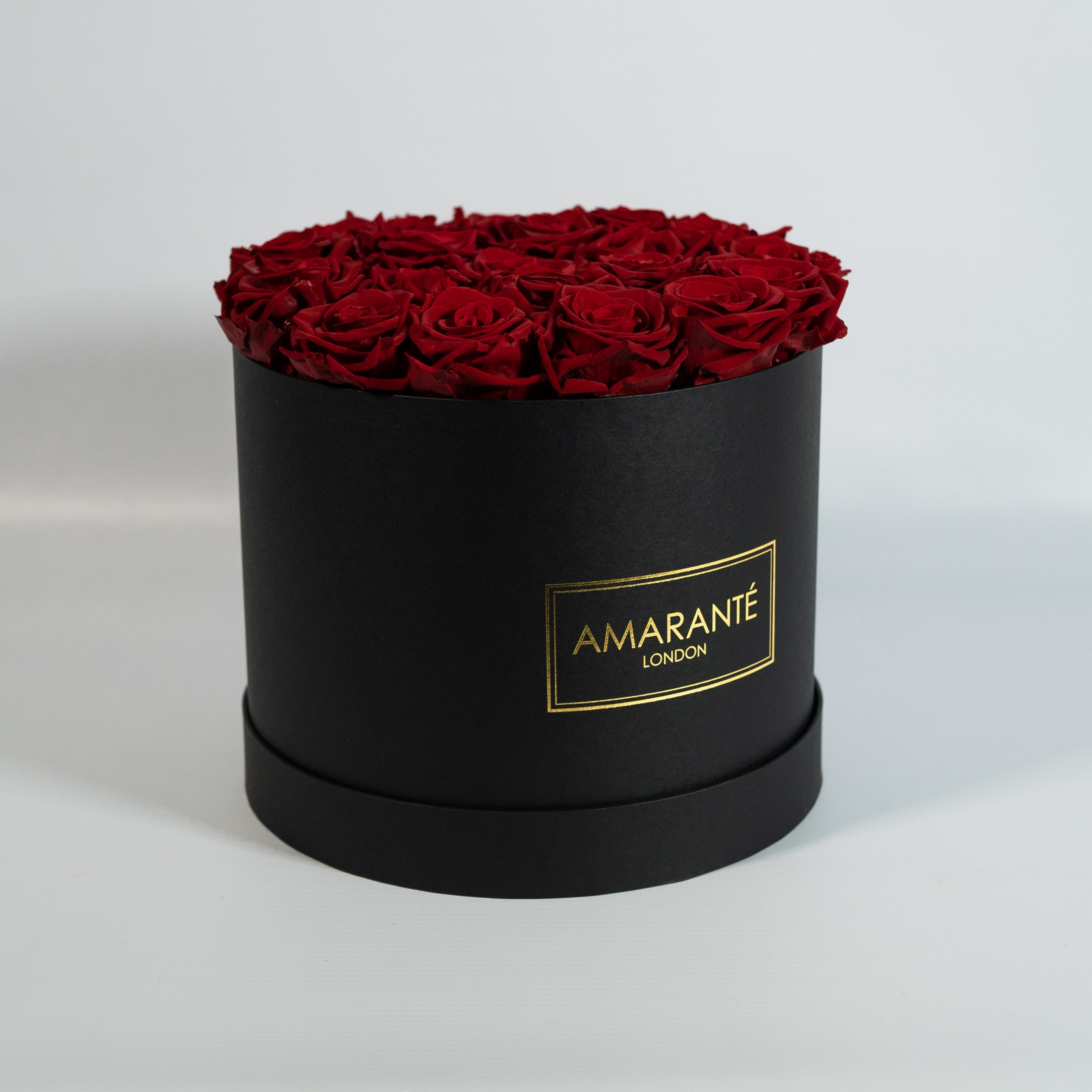 Artful wine red Roses denoting courage, admiration, and determination 