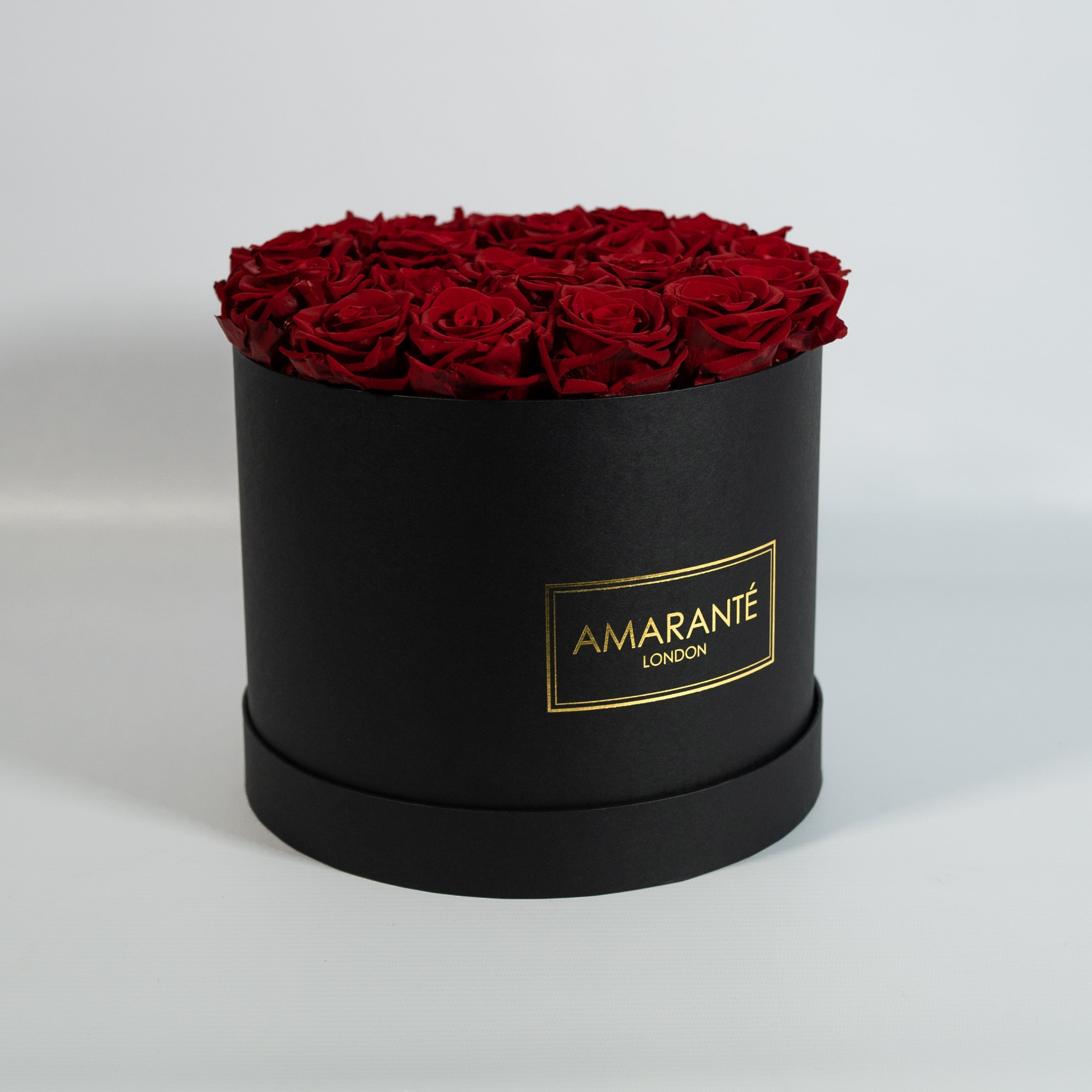 Artful wine red Roses denoting courage, admiration, and determination 