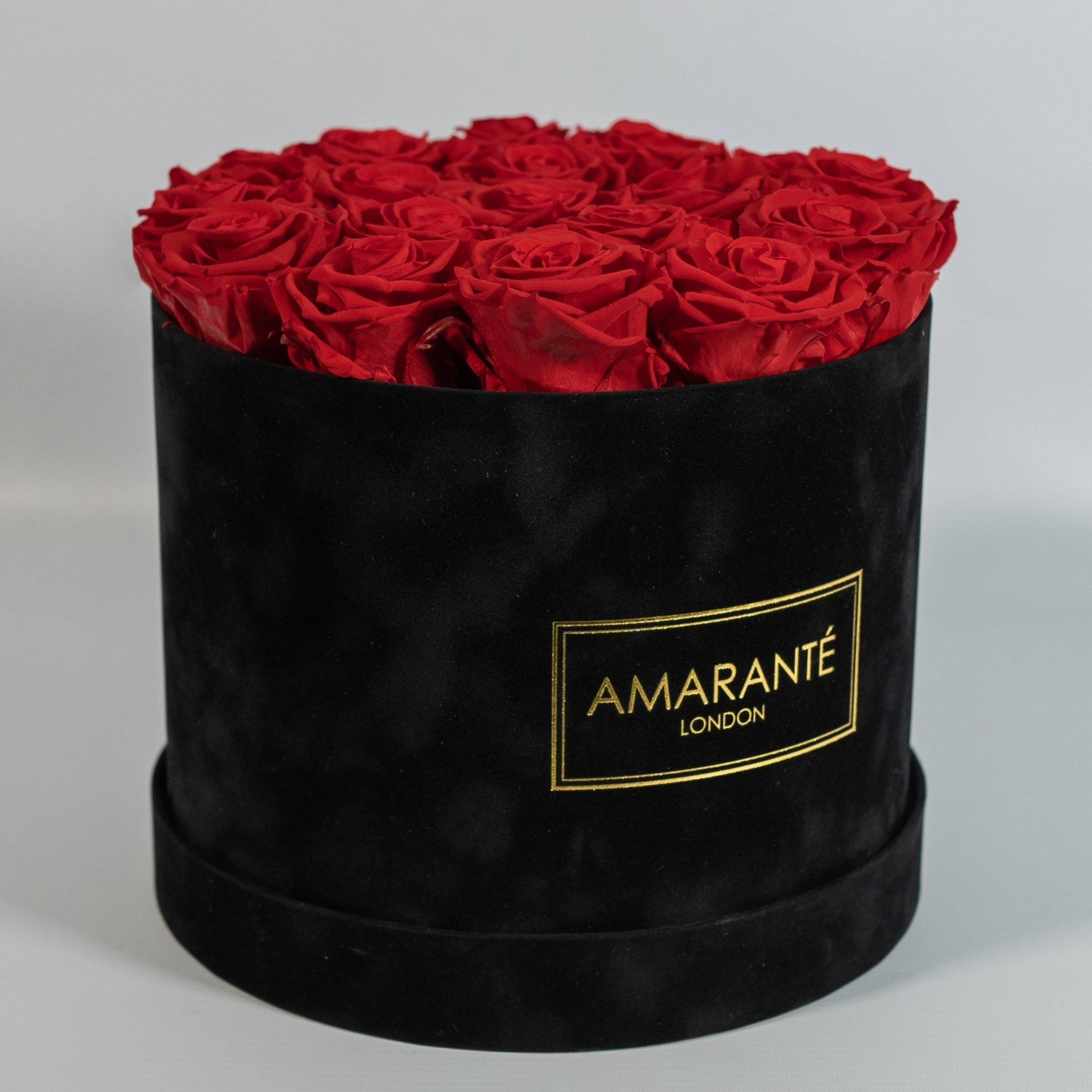 Magical red Roses photographed in a dapper black box 