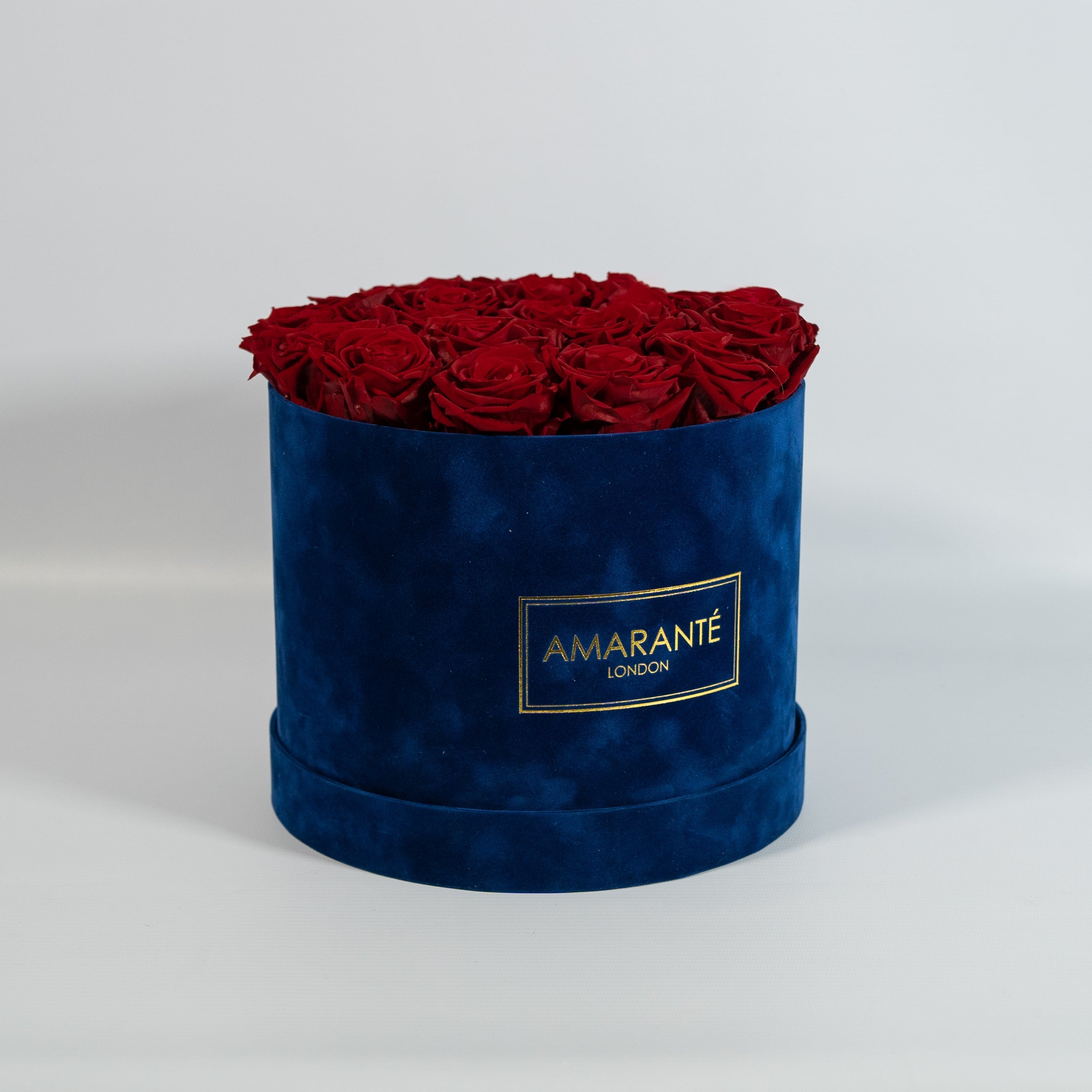 Enchanting wine red Roses accessible in a charming blue box 