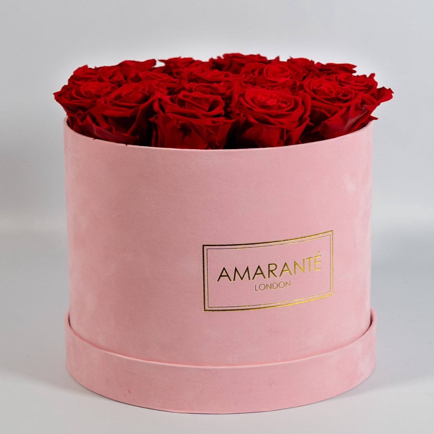 Divine red Roses in a stunning pink suede box 
