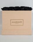Stylish black coloured Roses shown in a modern beige package. 