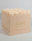 Exciting Champagne Roses in a beautiful beige box.
