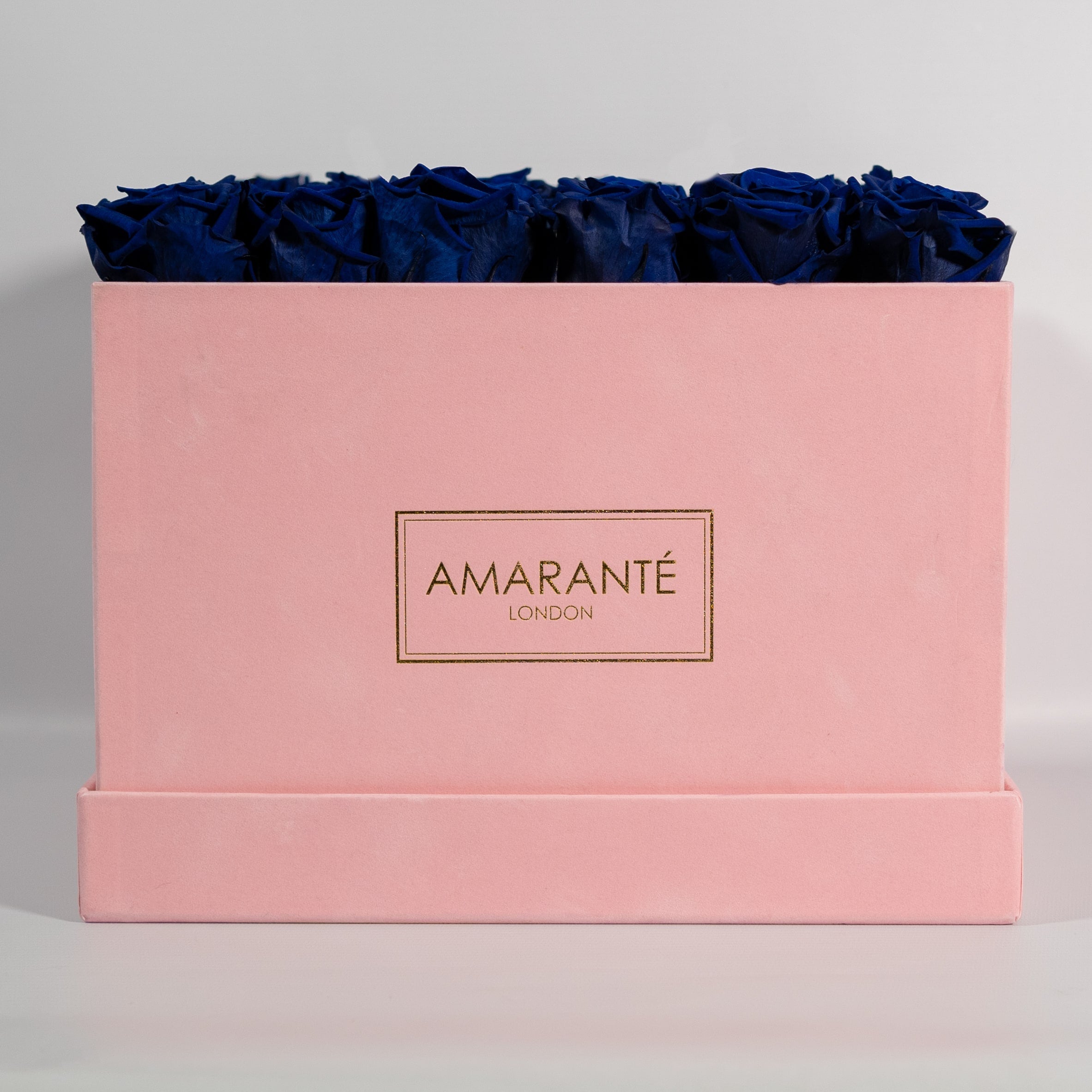 Luxurious royal blue roses exhibited in a gorgeous pink box 