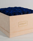 Luxurious royal blue Roses in an extra large beige box.