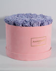 Tranquilising  Lavender Roses imbedded in a sophisticated pink box 