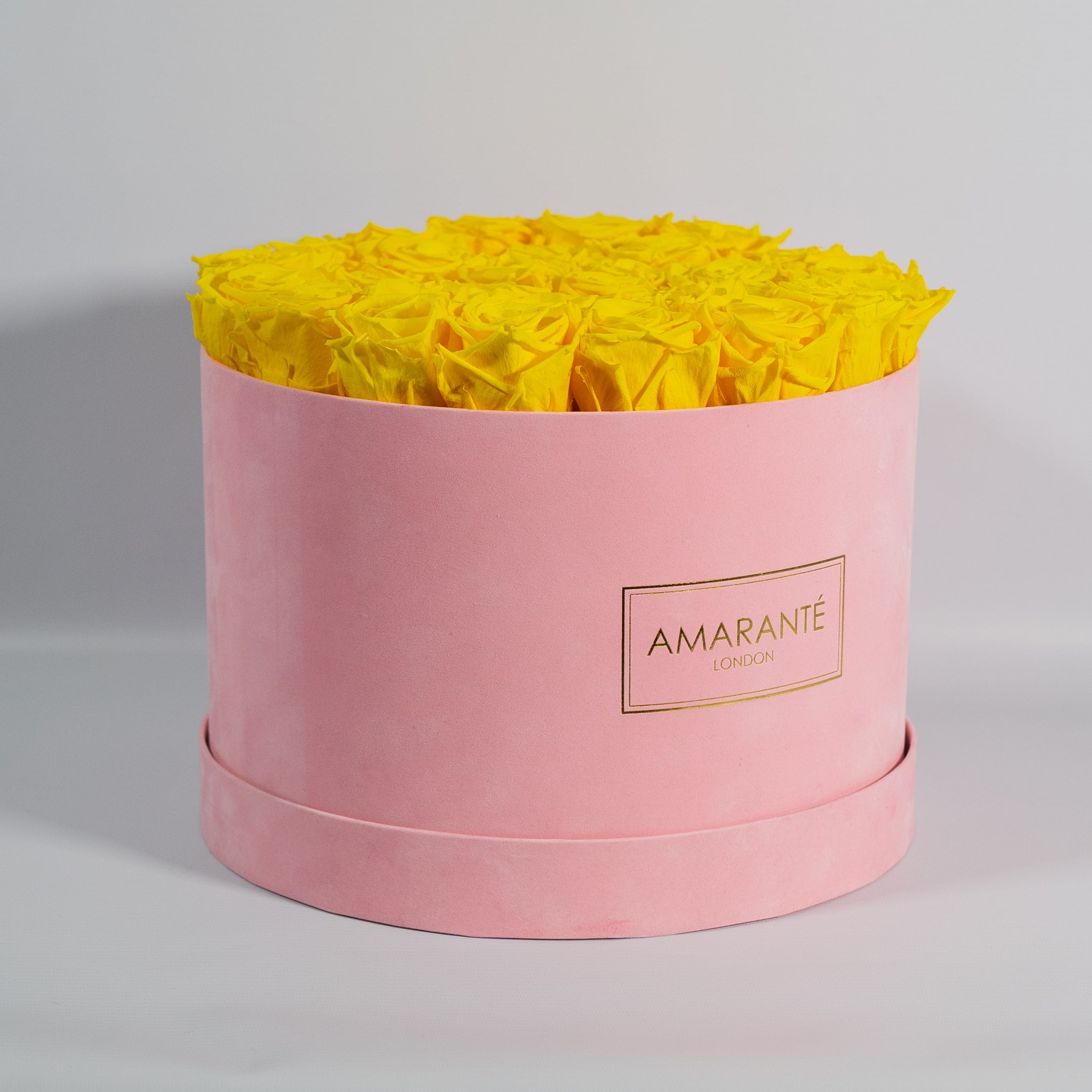 Delightful yellow Roses in a chic pink box 