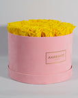 Delightful yellow Roses in a chic pink box 