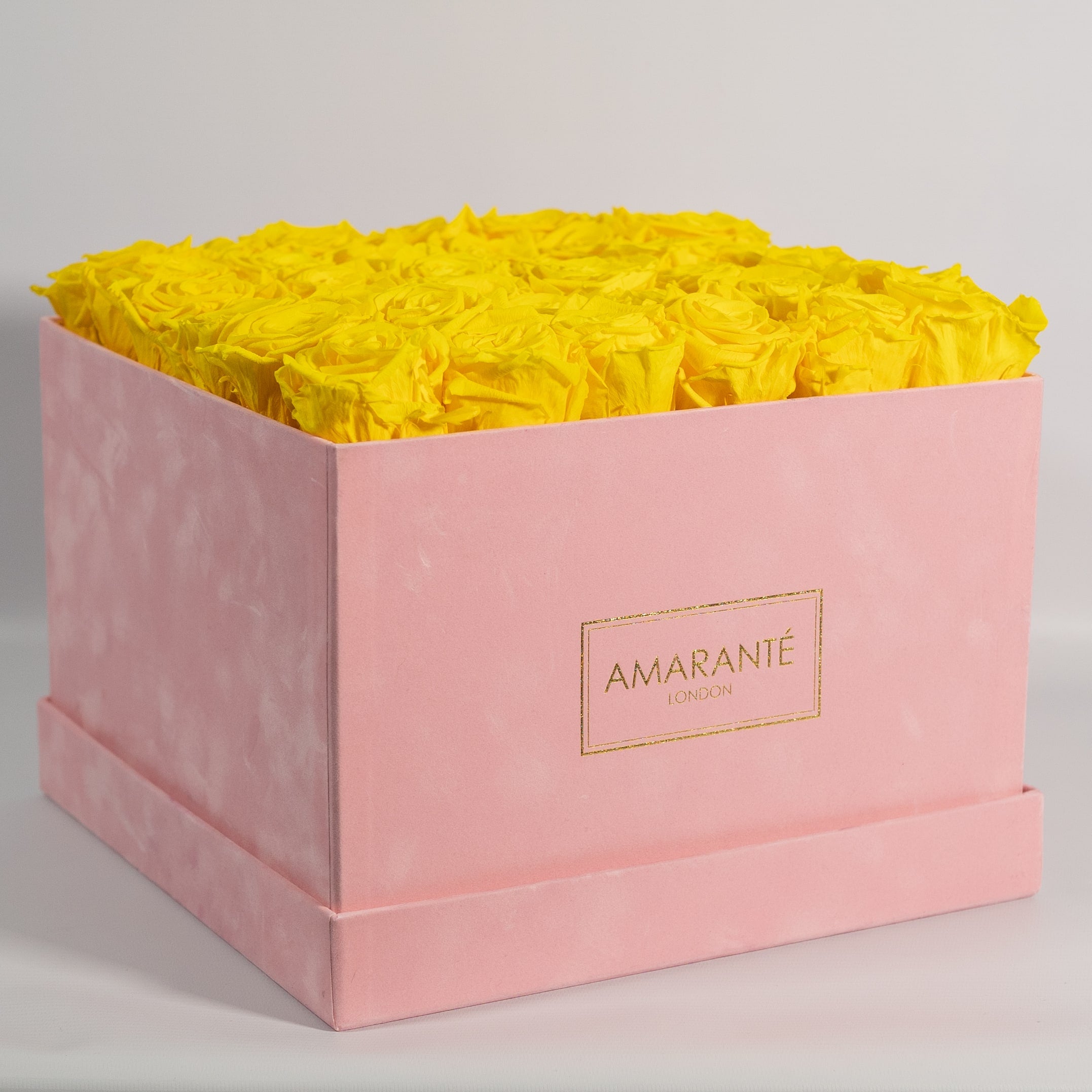 Delightful yellow roses encompassed in a gorgeous pink box 