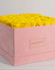 Delightful yellow roses encompassed in a gorgeous pink box 