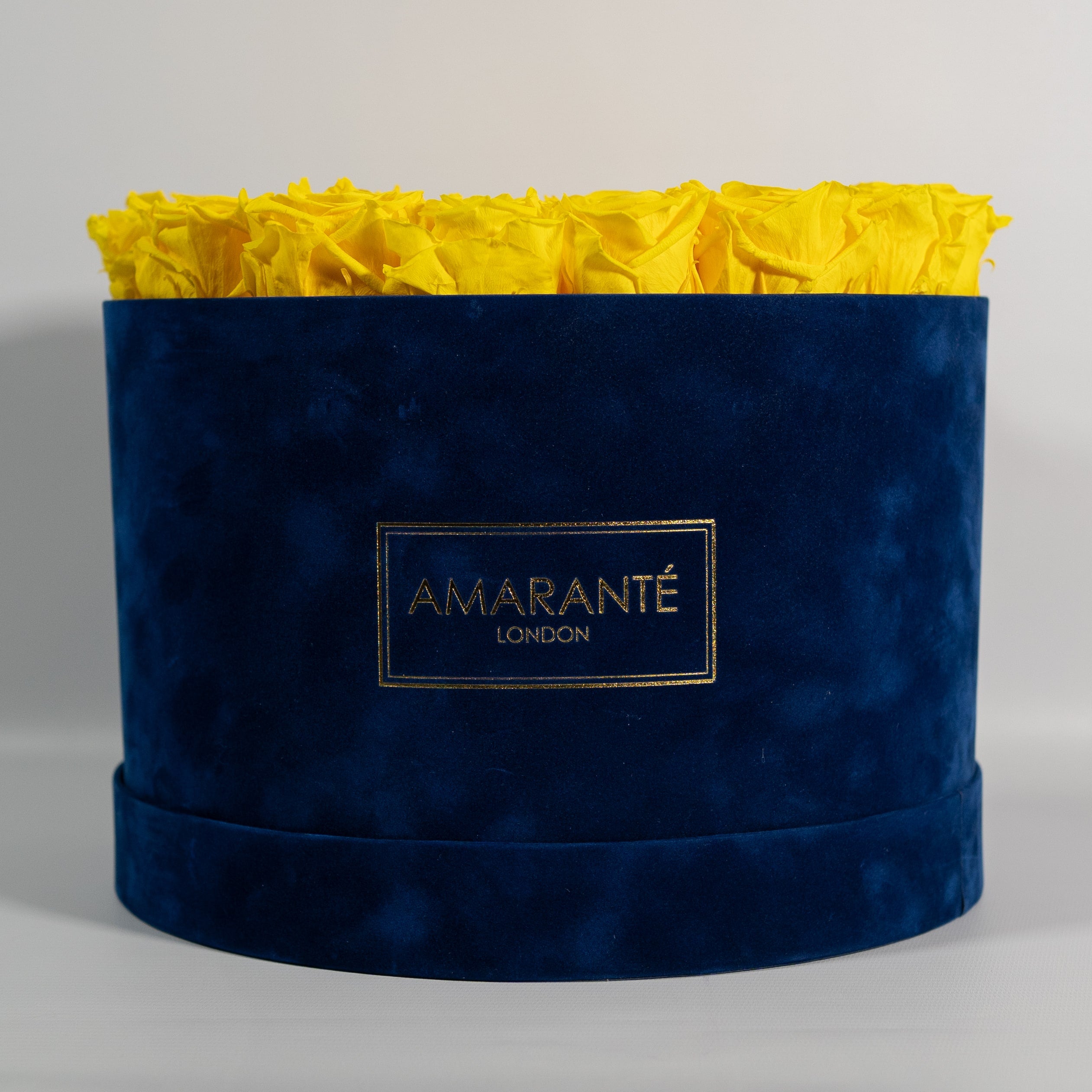Summer inspired yellow roses available in a classic blue box.