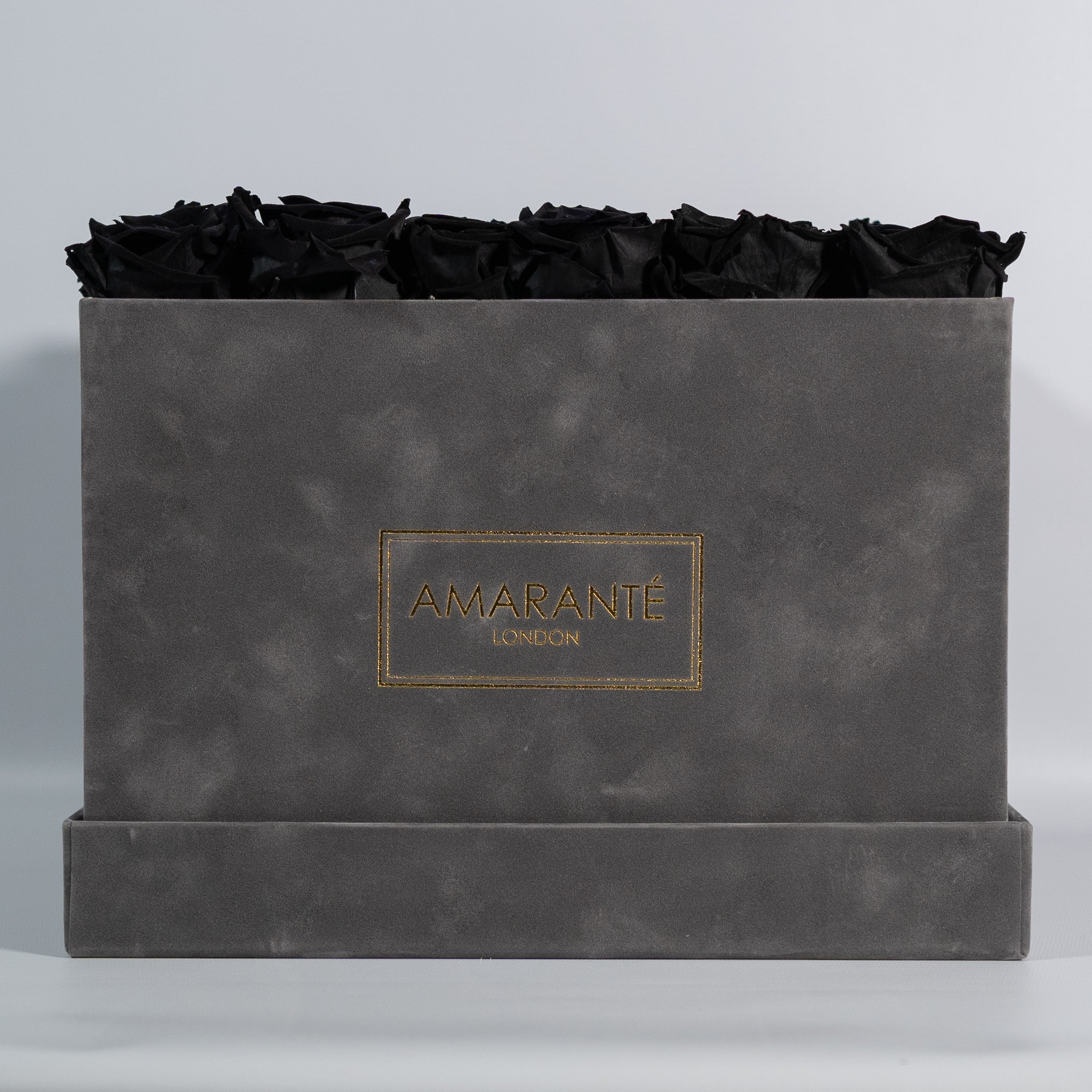 Bold black Roses available in a majestic grey package. 